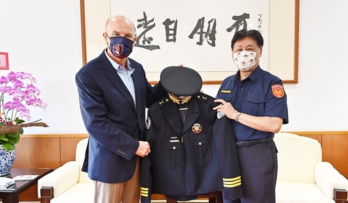 IACP President Henninger contributed his police uniform.